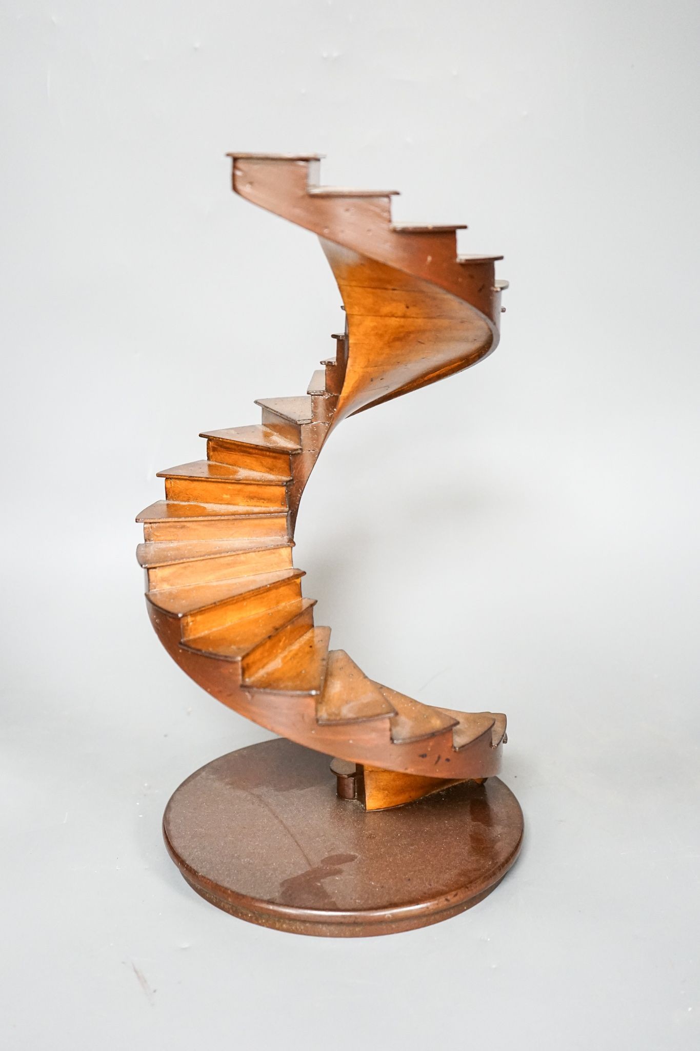 A small wood model spiral staircase together with a section of plaster frieze work (2) 37cm